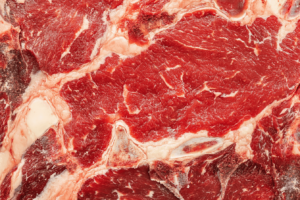 Tomahawk steak showing the long rib bone and marbling